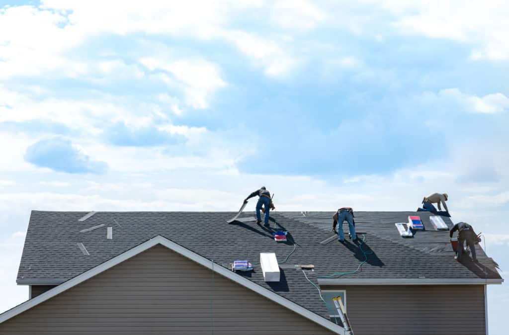 Roofers roofing a roof